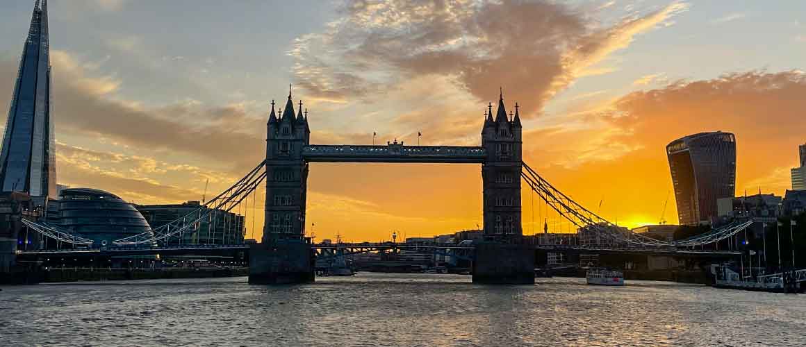 Tower Bridge glowing against a sunset sky. Part of London's UNESCO sites. 